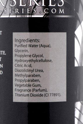 Close-up of Jizz Water Based Cum Scented Lube ingredient label listing water, glycerin, propylene glycol, and fragrance.