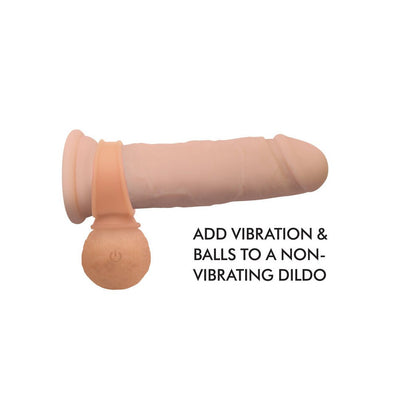 Silicone vibrating balls accessory attached to a dildo, designed to add vibration and texture.