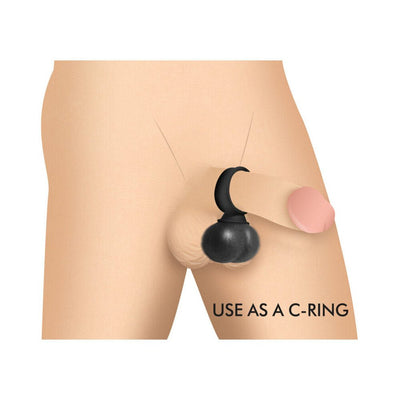 Illustration of black vibrating silicone balls worn as a c-ring on a male figure.