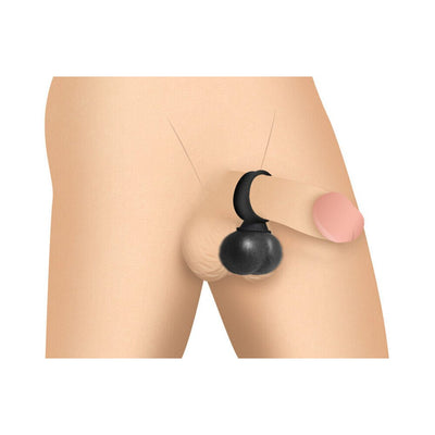 Black vibrating silicone balls worn as a ring around the base of a penis on a skin-toned mannequin.