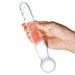 Hand holding a clear glass dildo wand with a spiraled shaft and rounded bulbous end for versatile stimulation.