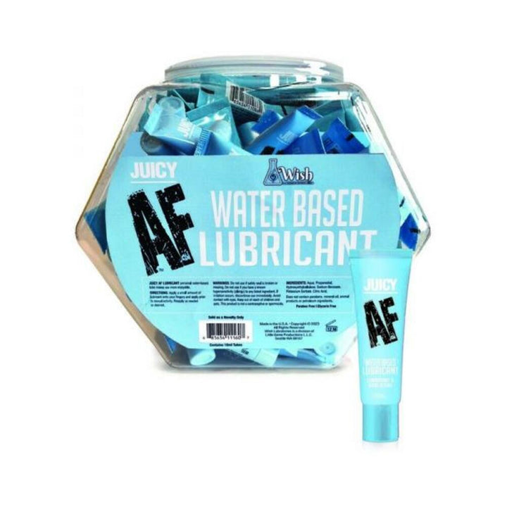 Clear fishbowl container filled with 65 blue 10ml tubes of Juicy AF water-based lubricant with one tube displayed outside.
