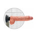 Realistic 10-inch vibrating dildo with suction cup base mounted on tiled wall in flesh tone color.