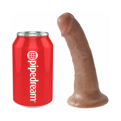 Brown realistic dildo with suction base next to a red soda can for size comparison on white background.