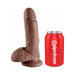 Realistic brown 7-inch dildo with textured base and suction cup next to a red Pipedream soda can for size comparison.