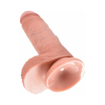 Realistic 7-inch flesh-toned dildo with detailed veins, balls, and suction cup base for hands-free use.