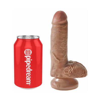 Tan realistic 7-inch dildo with suction cup base shown next to a red soda can for size comparison.