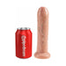 Realistic 7-inch uncut dildo with movable foreskin and suction base next to a red Pipedream soda can for size comparison.