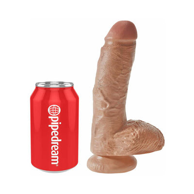 Realistic 8-inch brown dildo with balls and suction base next to a red soda can for size comparison.