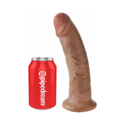 Realistic 9-inch brown dildo with suction base next to a red Pipedream soda can for size comparison.
