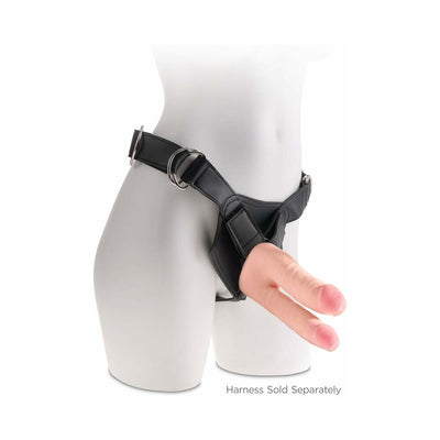 Beige double-ended realistic dildo attached to a black adjustable strap-on harness on a mannequin.