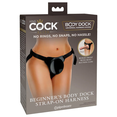 Packaging of King Cock Elite Beginner's Body Dock Strap-on Harness showing adjustable black harness with suction dock on model.