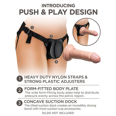 Close-up of King Cock Elite Beginner's Body Dock Strap-on Harness showing adjustable nylon straps, form-fitted body plate, and concave suction dock.