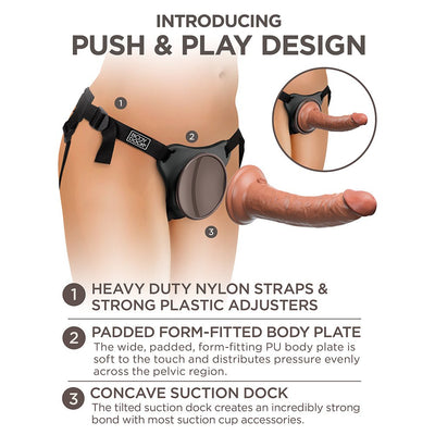 Diagram showing King Cock Elite Comfy Silicone Body Dock Kit with adjustable nylon straps, padded body plate, and concave suction dock features.