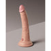 Realistic 7-inch dual-density silicone dildo with suction cup base in light skin tone standing upright on gray surface.