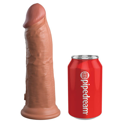 Realistic dual-density silicone dildo in natural skin tone next to a red Pipedream soda can for size comparison.
