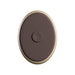 Oval dark brown and beige remote control with a central button for King Cock Elite vibrating silicone dildo.