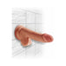 Tan 6.5-inch realistic triple density dildo with suction cup base mounted on tiled wall.