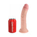 Realistic 8-inch flesh-toned dildo with suction base next to a red soda can for size comparison