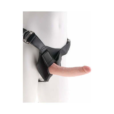 Black adjustable strap-on harness with a beige 7-inch realistic dildo attached on a white mannequin.
