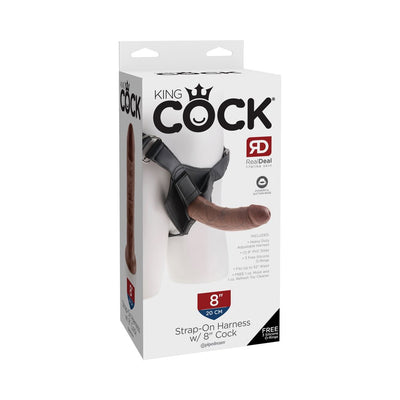 Packaging of King Cock strap-on harness with 8-inch lifelike dildo and adjustable black vinyl harness.