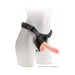 Beige realistic 7.5-inch dildo with balls attached to a black adjustable harness on a white mannequin.