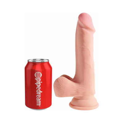 Beige King Cock Triple Density 7.5 inch dildo with balls next to a red Pipedream soda can for size comparison.