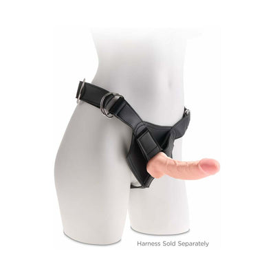 Beige 8-inch realistic dildo attached to a black strap-on harness on a white mannequin torso.