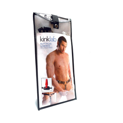 Kinklab men's butt plug harness with cock ring in clear packaging featuring a shirtless male model wearing the harness.
