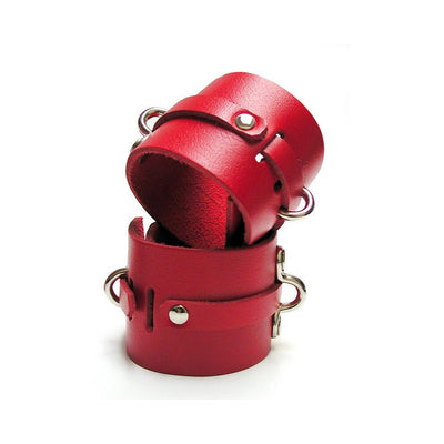 Pair of red leather ankle cuffs with metal hardware designed for secure and comfortable restraint.