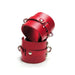 Pair of red leather ankle cuffs with metal hardware designed for secure and comfortable restraint.