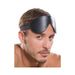 Man wearing a black padded leather blindfold with an elastic strap for sensory play and comfort.