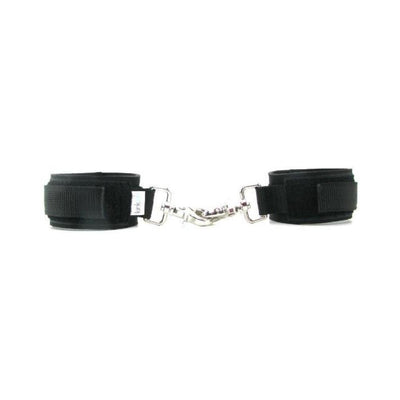 Pair of black neoprene cuffs with Velcro straps and metal clips connected in the center for adjustable fit and secure fastening.