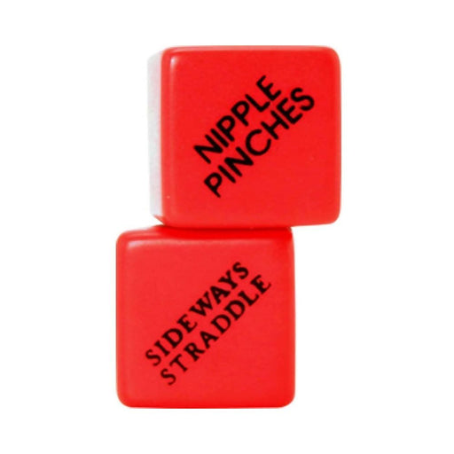 Two red BDSM dice stacked, one showing "Nipple Pinches" and the other "Sideways Straddle" in black text.