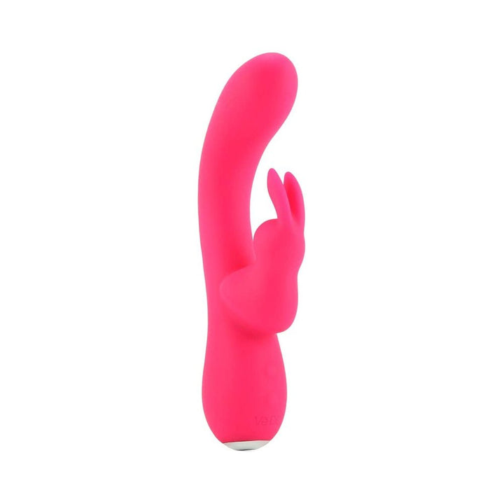 Foxy pink VeDO Kinky Bunny Plus dual motor vibrator with curved shaft and rabbit-shaped clitoral stimulator.