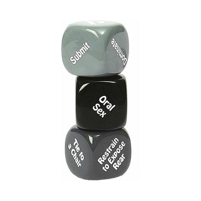 Stack of three glossy dice with white text showing options for roles, actions, and restraints for a playful adult game.