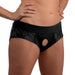 Black lace crotchless panty harness with wide elastic waistband and central O-ring detail, worn on model's hips.