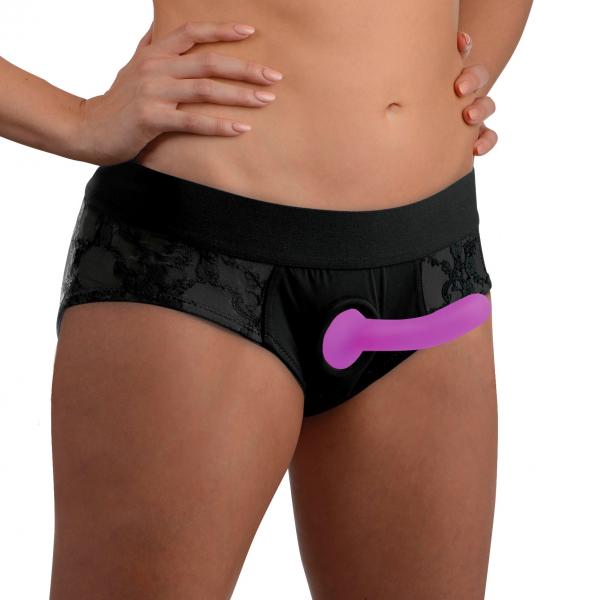 Black lace crotchless panty harness with attached purple silicone dildo worn on model waist