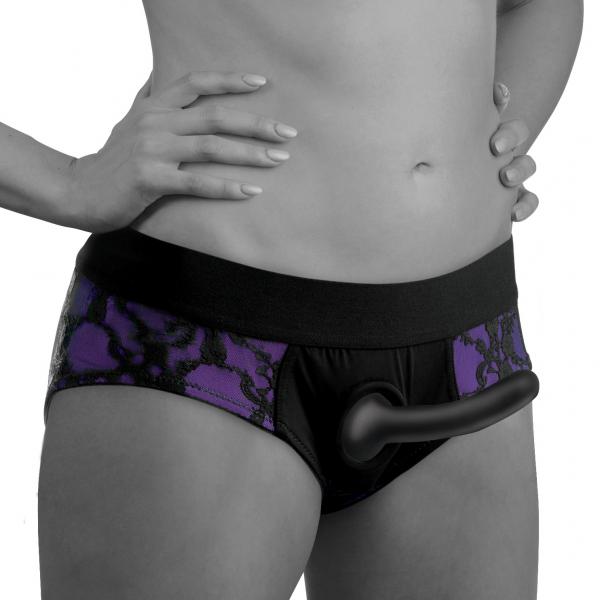 Close-up of a person wearing purple and black lace crotchless panty harness with attached curved black silicone dildo.