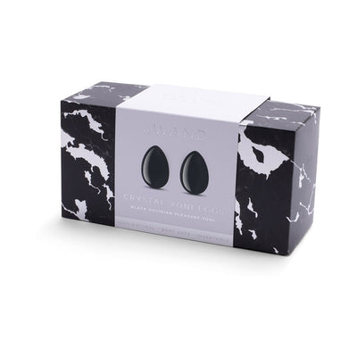 Le Wand Crystal Yoni Eggs black obsidian set in sleek black and white marbled box with minimalist label.