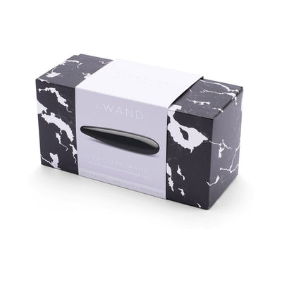 Le Wand Crystal Slim Wand in black obsidian displayed on black and white marbled packaging box with white label.