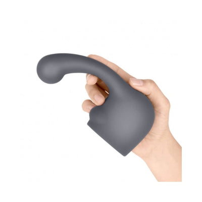 Hand holding a curved, dark gray silicone attachment designed for Le Wand massagers.