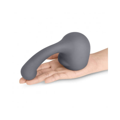 Hand holding a gray curved silicone attachment designed for Le Wand massagers, featuring a smooth, ergonomic shape.