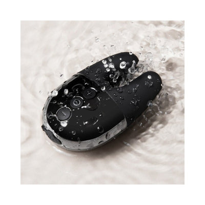 Le Wand Double Vibe in black with water droplets, showcasing its waterproof design and compact size.