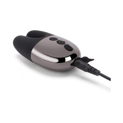 Le Wand Double Vibe compact rechargeable vibrator with dual silicone tips and control buttons shown charging.