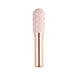 Le Wand Grand Bullet with textured silicone sleeve and sleek rose gold handle on white background.