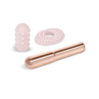 Le Wand Grand Bullet vibrator with two removable textured silicone sleeves in soft pink and rose gold finish.