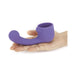 Hand holding a purple silicone curved attachment designed for the Le Wand Petite rechargeable massager.