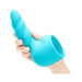Hand holding a blue silicone textured attachment with a twisted design for the Le Wand Unicorn Wand collection.