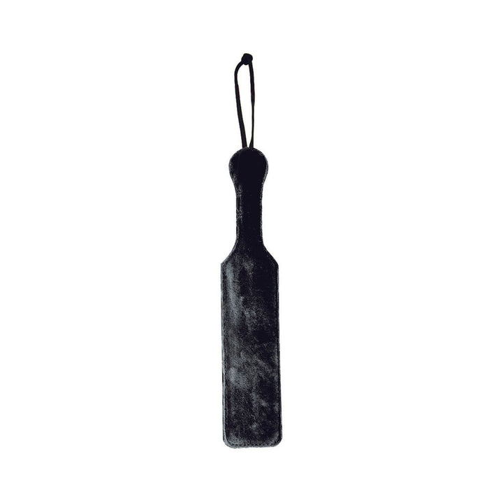 Black leather paddle with soft black faux fur side and wrist strap for secure grip.